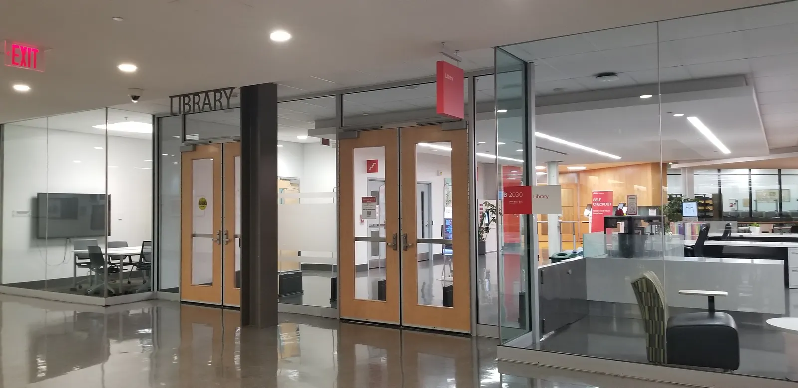 Wooden doors and glass walls at the library entrance on Seneca Newnham Campus