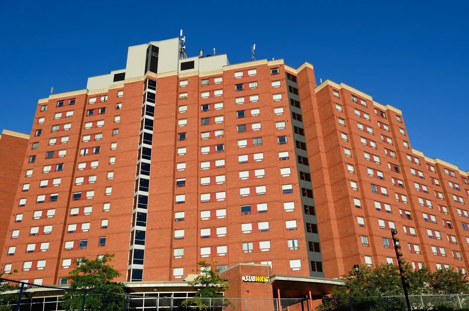 Tall red-brick Seneca residence tower at 1760 Finch Avenue East, Newnham Campus