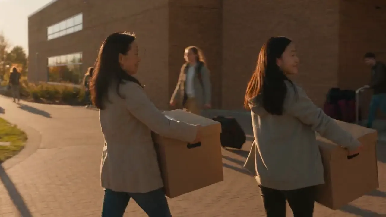 A student arriving at university residence with family