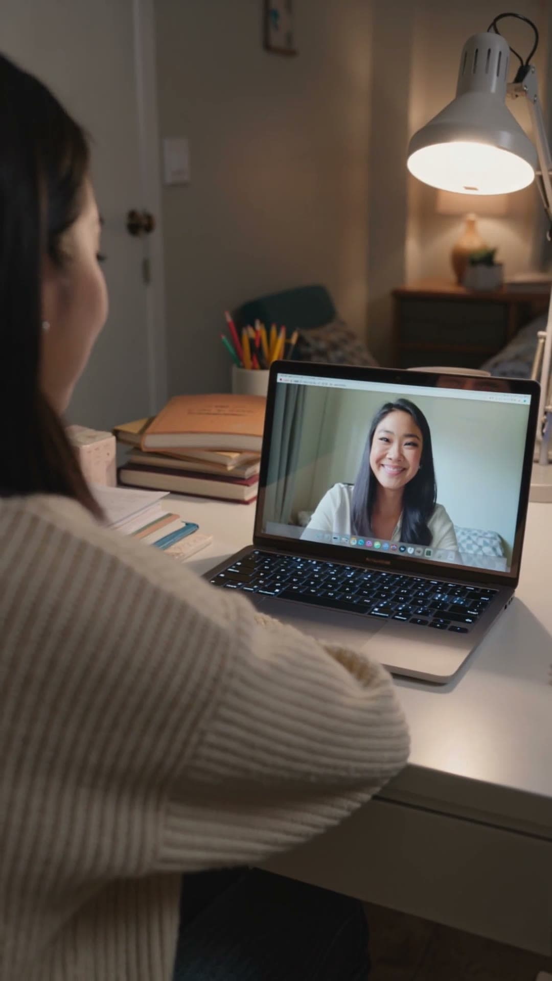 A student meeting an adviser over a video call
