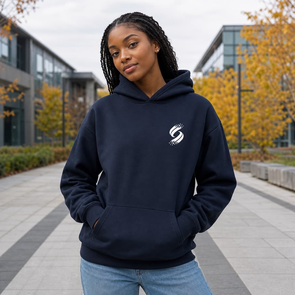 Student wearing the midnight Stellar Core Hoodie on campus