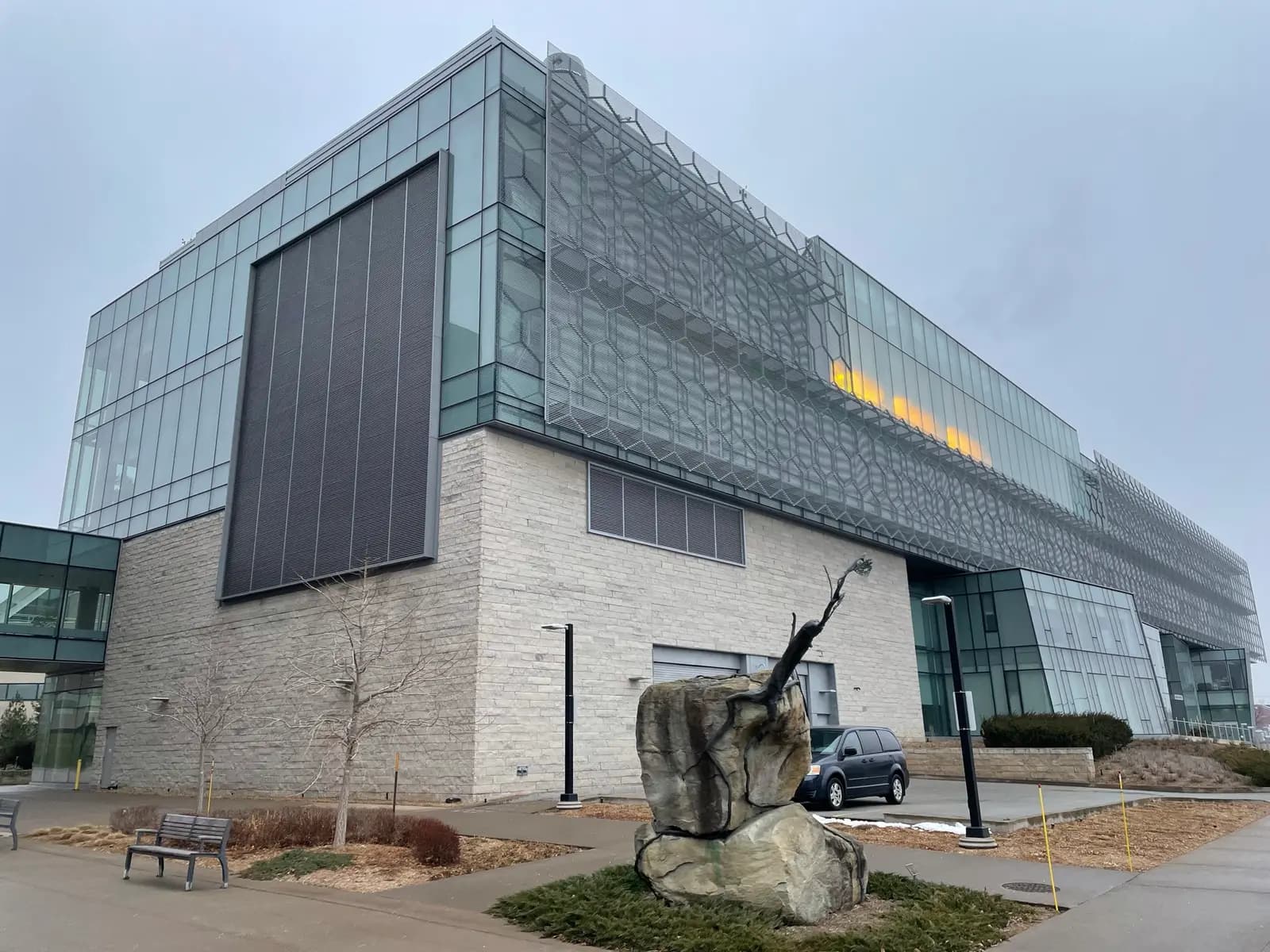 Glass and stone exterior of the Cairns Family Health and Bioscience Research Complex at Brock University