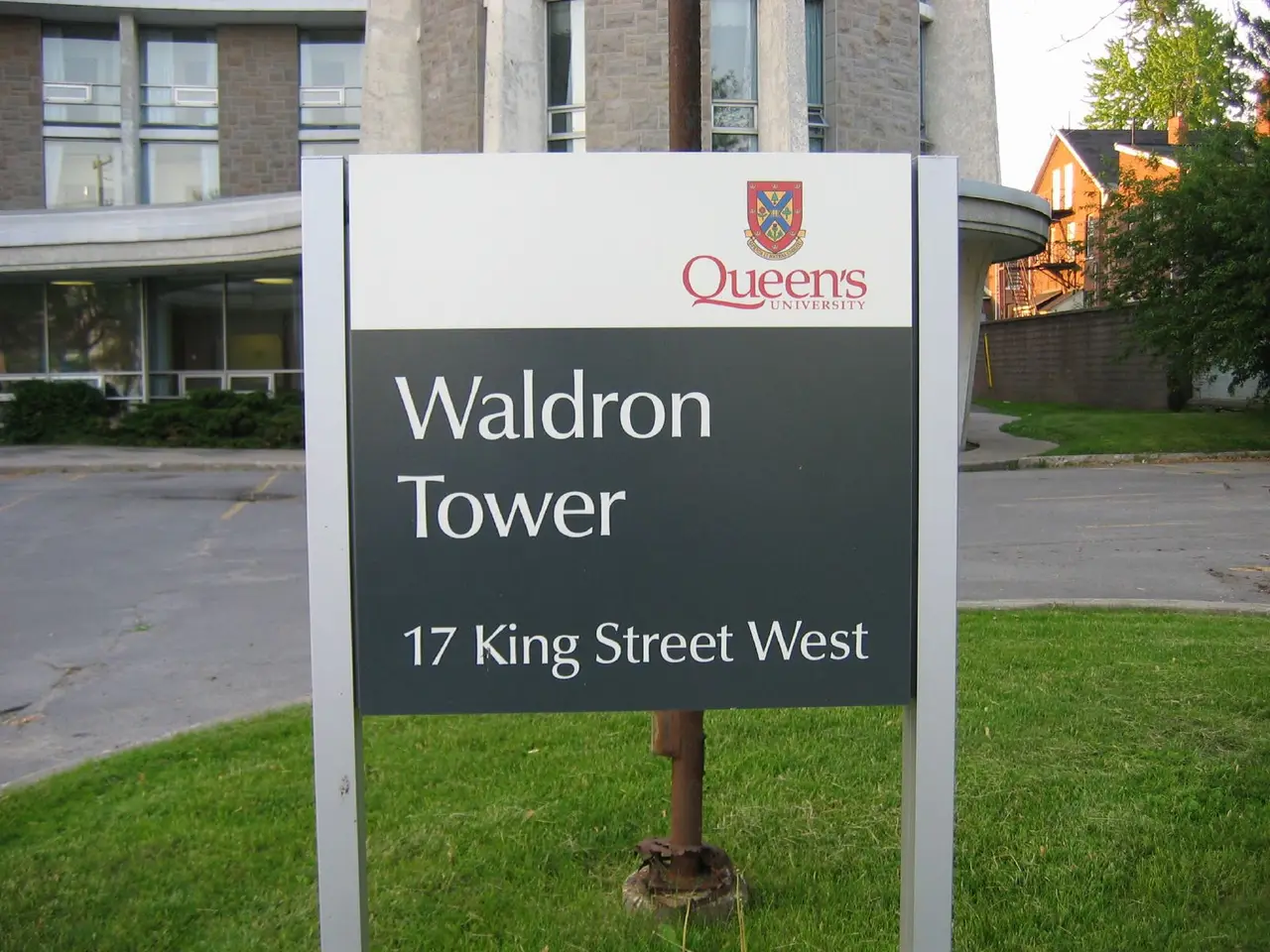 Queen's University sign reading Waldron Tower, 17 King Street West, in front of the residence entrance