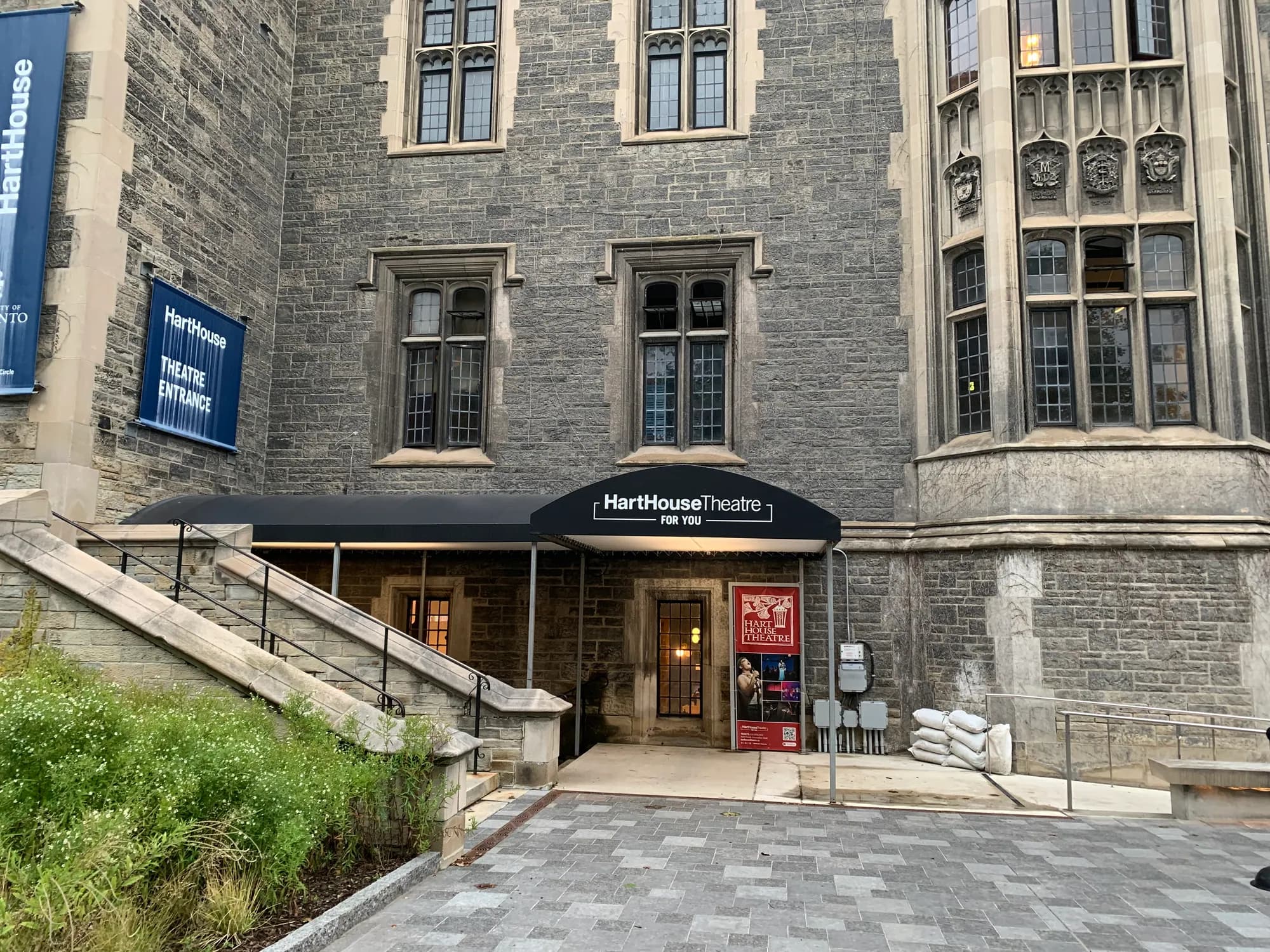 Entrance to Hart House Theatre in a stone courtyard at U of T