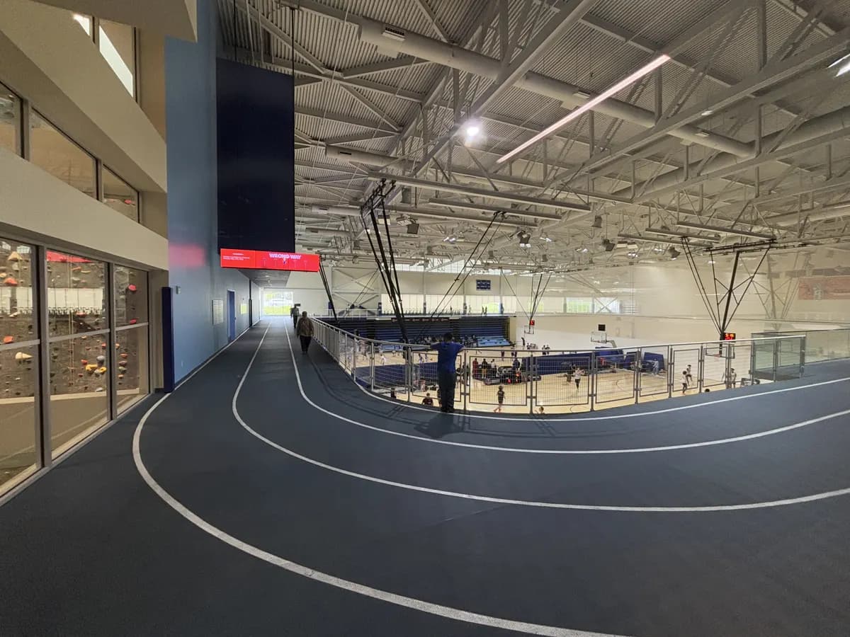 Indoor running track overlooking basketball courts at Toronto Pan Am Sports Centre