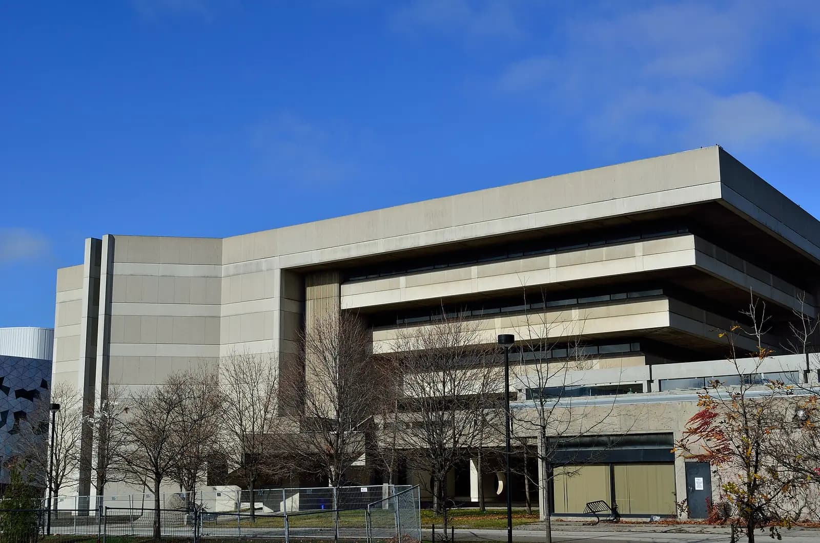 Concrete exterior of Scott Library at York University under a blue sky